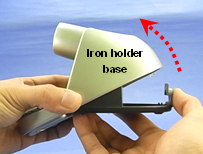 2. Open the iron holder base while pressing the slide lock.