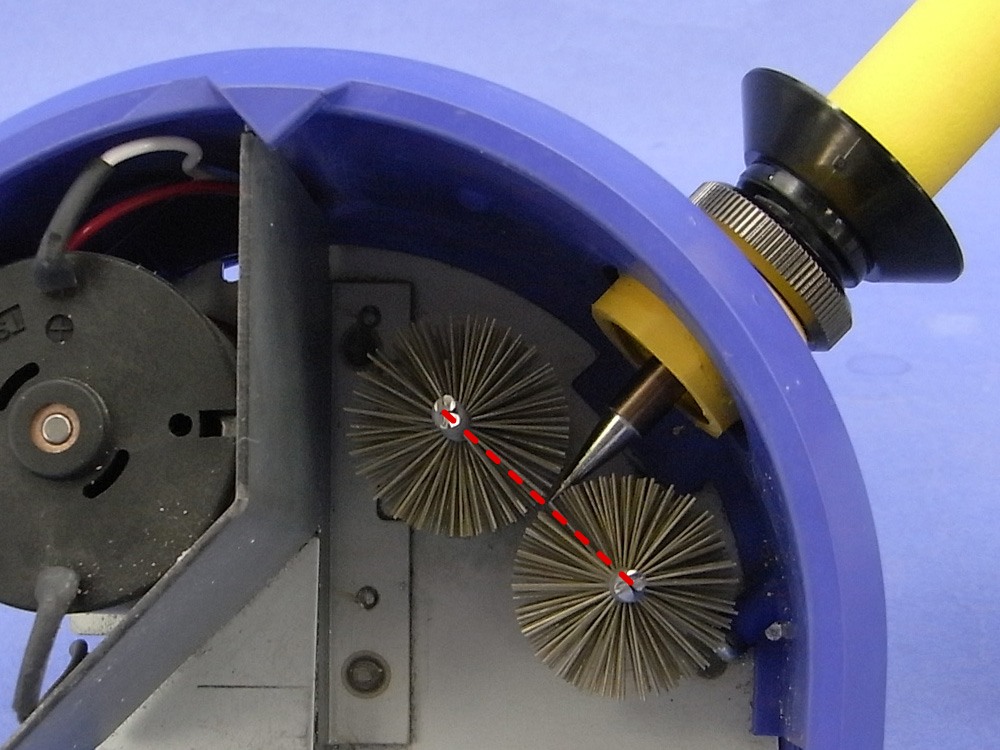 Adjust the receptacle as the tip end comes to the line of the axis on two brushes.